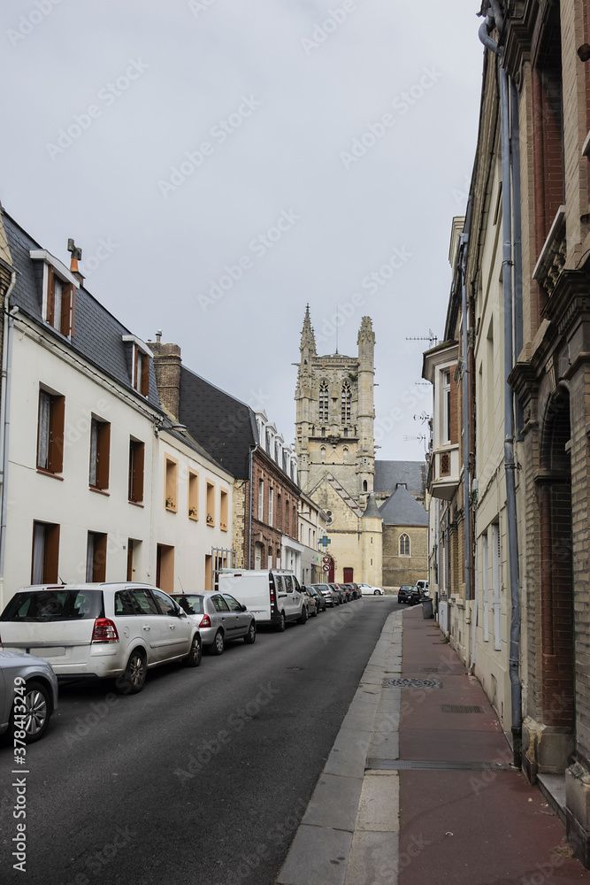 Built in heart of Fecamp XVI century Saint-Etienne church dominates now wearing Norman city: Renaissance portal, flamboyant Gothic steeple. Fecamp, Seine-Maritime department, Haute-Normandie, France.