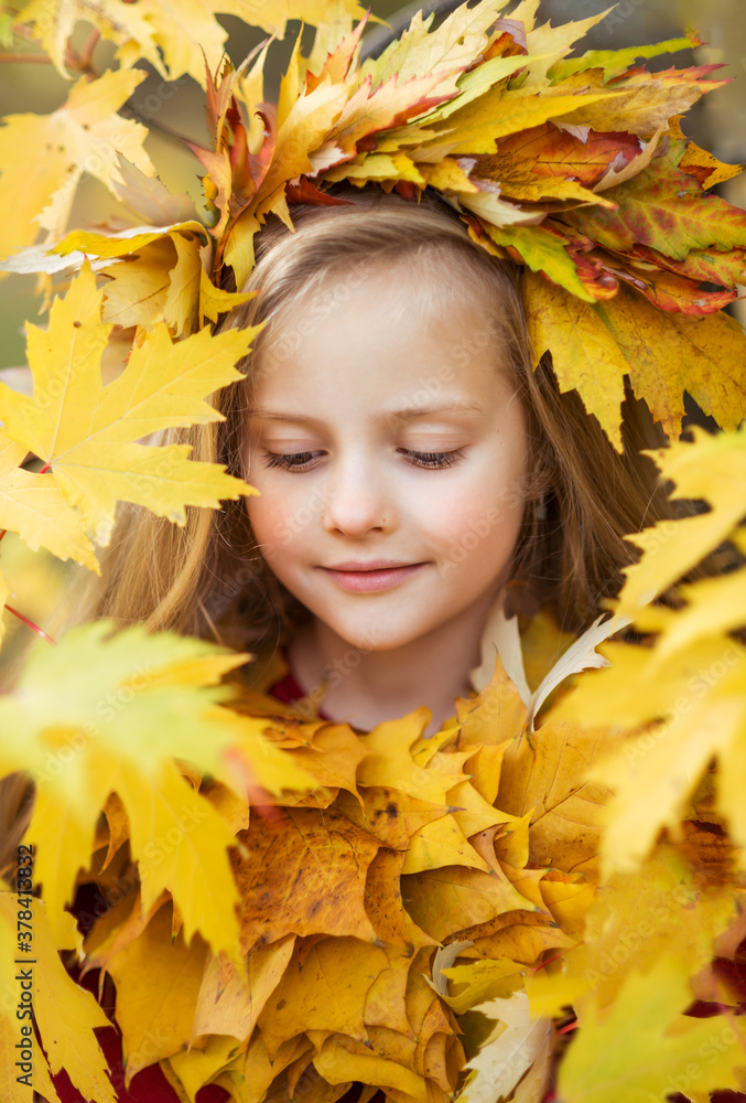 portrait of a girl in autumn leaves portrait of a girl in autumn leaves