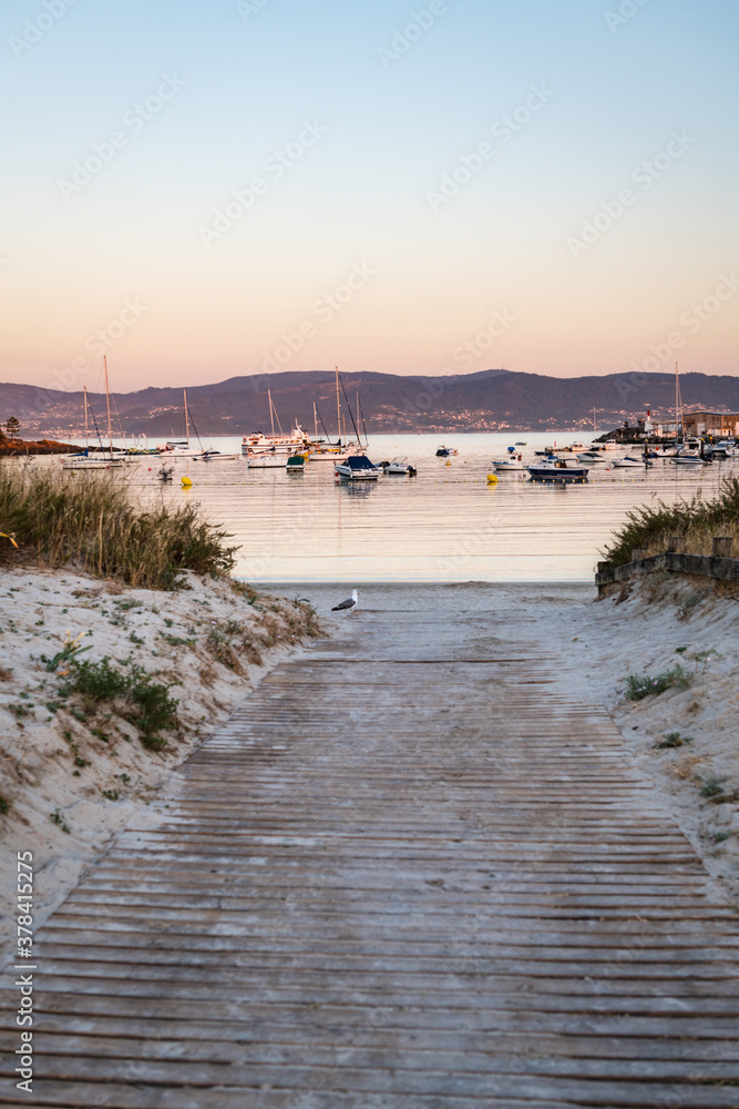 Vertical view of beach and sport port of Portonovo full of small motor boats, Portonovo, Spain.