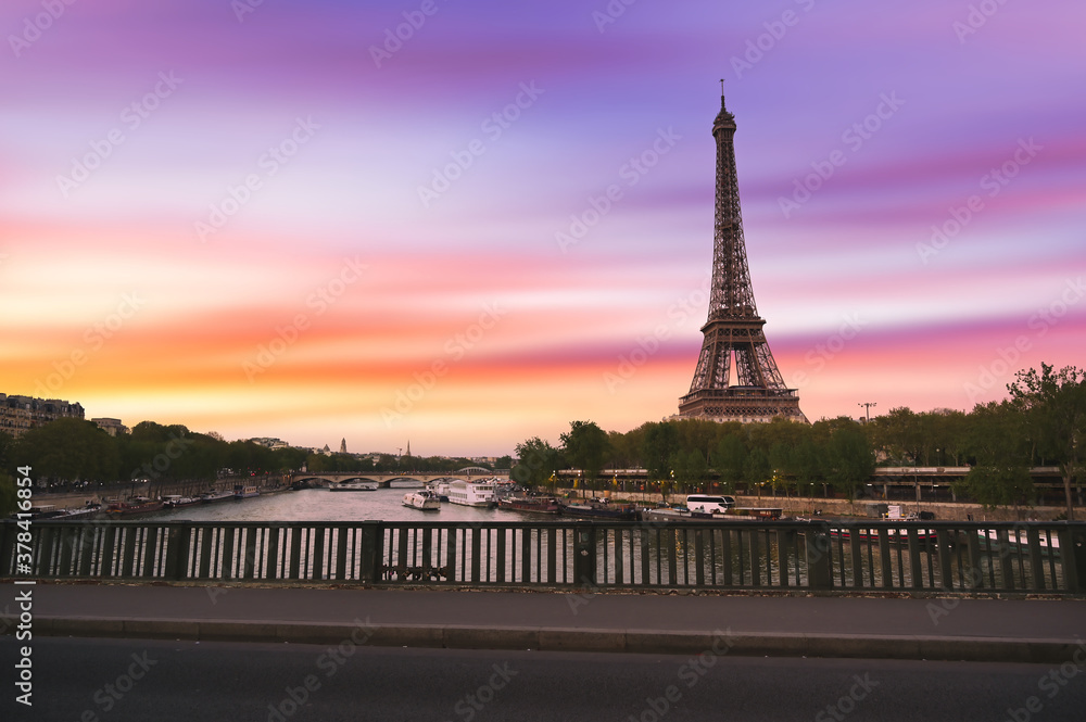 Sunset over the the Eiffel Tower and the Seine River in Paris, France.