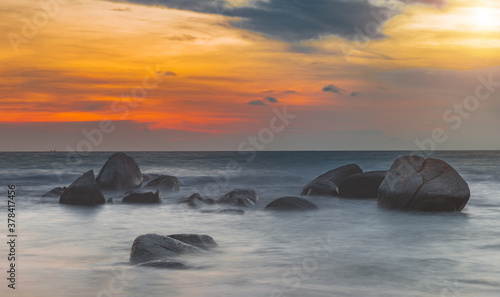 The sea and rock with sunset lighting.