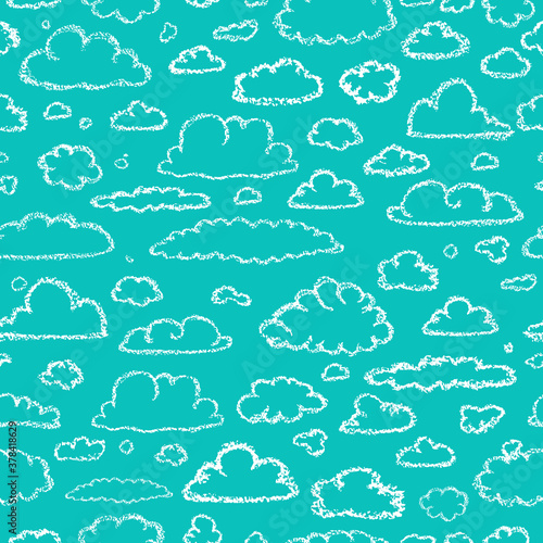Clouds pattern. Children drawling style cloud print. Hand drawn wax crayons art on blue backdrop. Chalk style isolated clouds background. White pastel crayons drawn clouds texture.