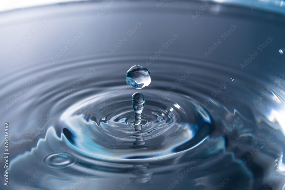 Abstract an outbreak of water. Splash of water close-up. Frozen water drop photographed at high speed.Slow dripping of liquid with air bubbles. Nature backgrounds or Wallpaper.Frozen liquid splashes