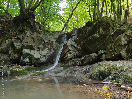 Rocky waterfall in Cheile Borzesti gorges, Romania photo