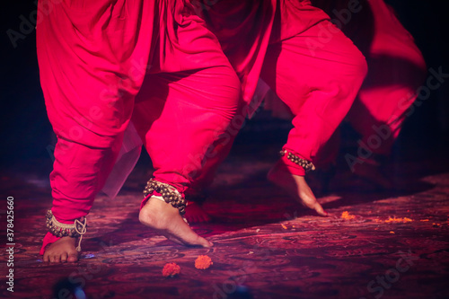 indian classical dance form in feet with musical anklet with selective focus and blur photo