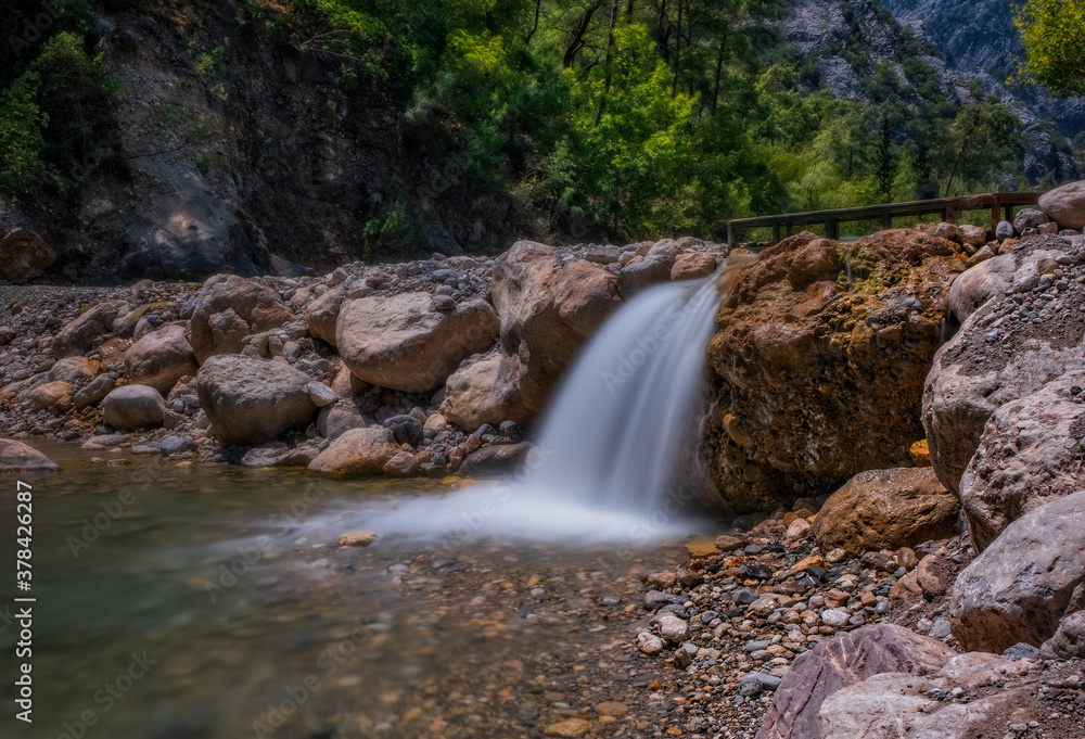 Fototapeta premium Little waterfall in Goynuk Canyon, Famous tourist place in Turkey. Long exposure picture, august 2020