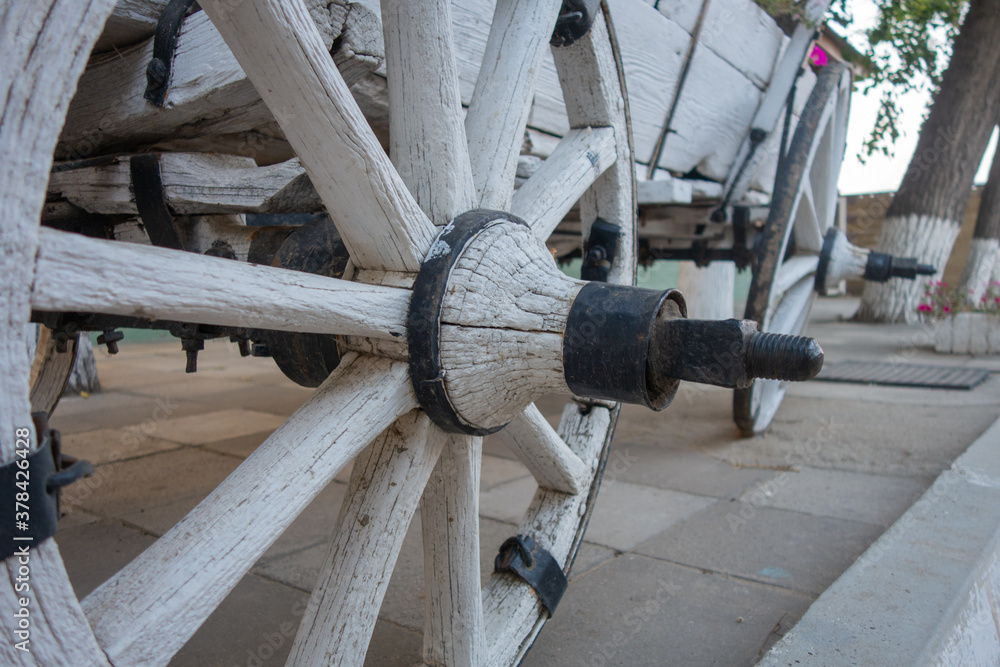 Antique gypsy cart white. Wheel close-up. Antique vehicle. Antique gypsy cart white. Wheel close-up. Antique vehicle.
