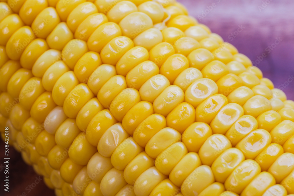 yellow corn stalk close up photo in wooden background yellow corn stalk close up photo in wooden background