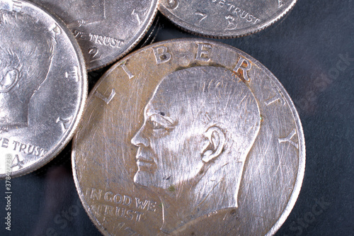 one dollar coin and fifty cent coin
