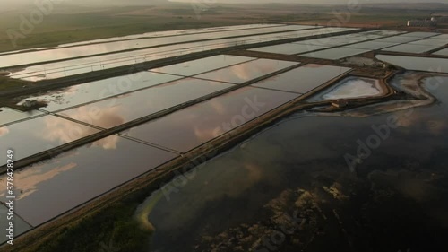 Sunset drone shot of salt lakes with cloud reflection photo