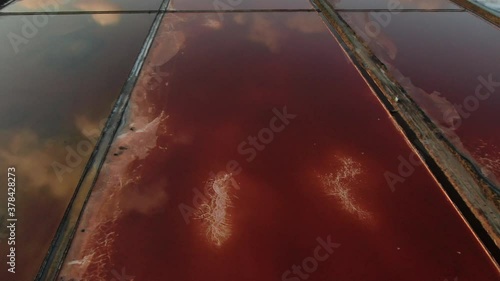 Beautiful drone shot over salt red lakes in Bulgaria near highway photo