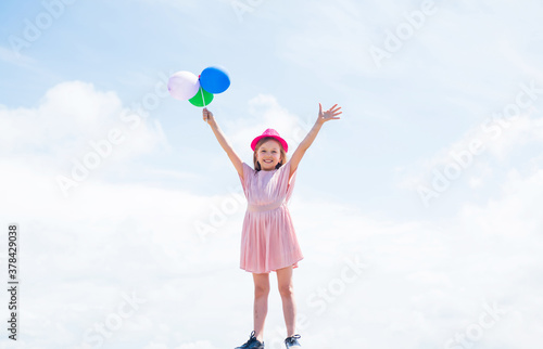 wow. prepare for holiday. ready to celebrate. concept of dreaming. childhood happiness. kid fashion beauty. imagination and inspiration. happy birthday party. small girl with party balloon © be free
