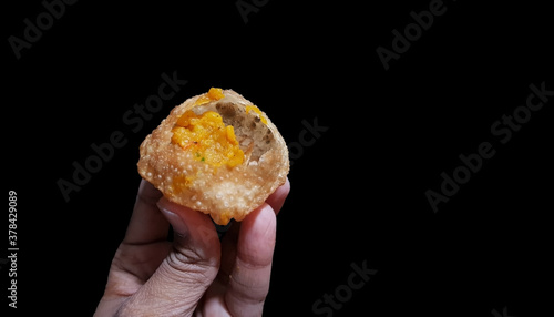 puchka paanipuri golgappa isolated on black background