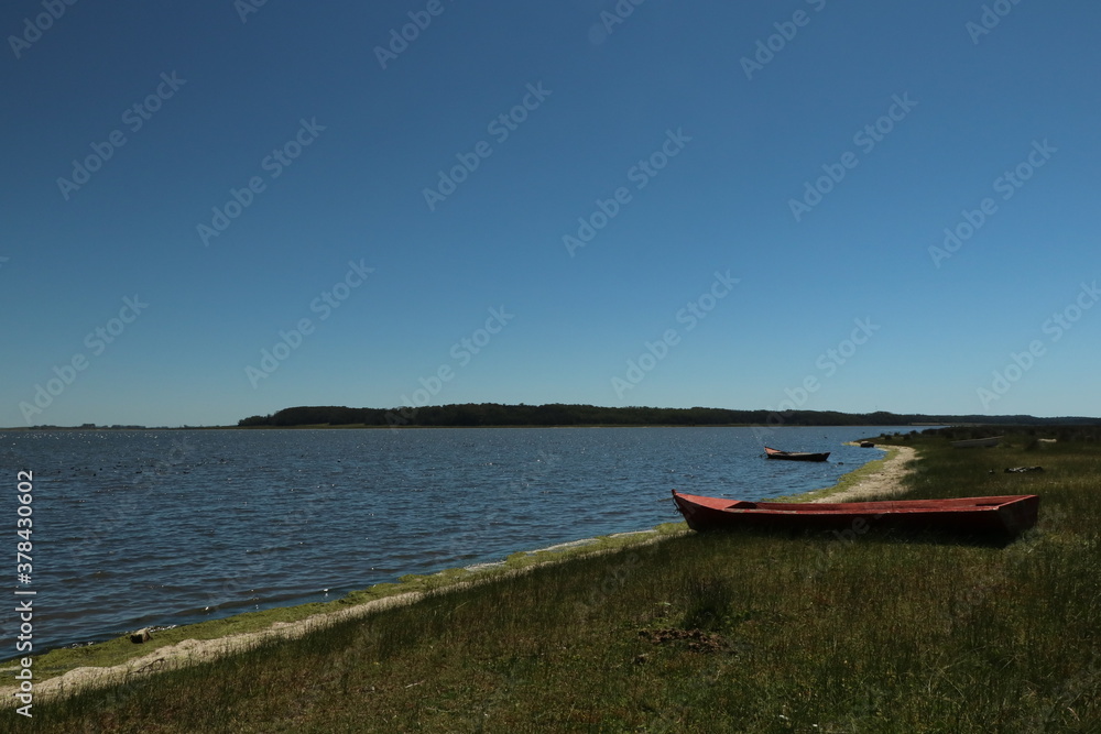 Small boats anchored in the lagoon waters