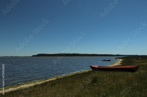 Fototapeta Naklejka Na Ścianę i Meble -  Small boats anchored in the lagoon waters
