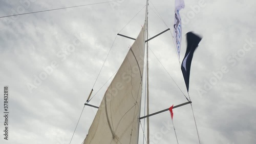 Hoisting the Main sail on a Beneteau in the North Sea photo