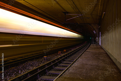 Fototapeta Naklejka Na Ścianę i Meble -  Speed lights of train on railway in tunnel