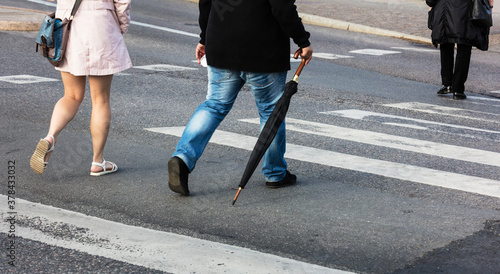 couple walking on pedestrian crossing