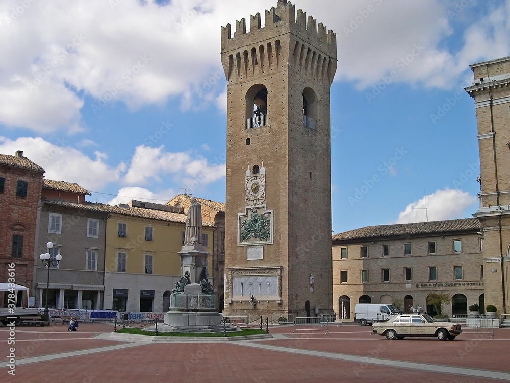 Italy, Marche, Recanati, the civic tower, the Leopardi statue in Leopardi square.
