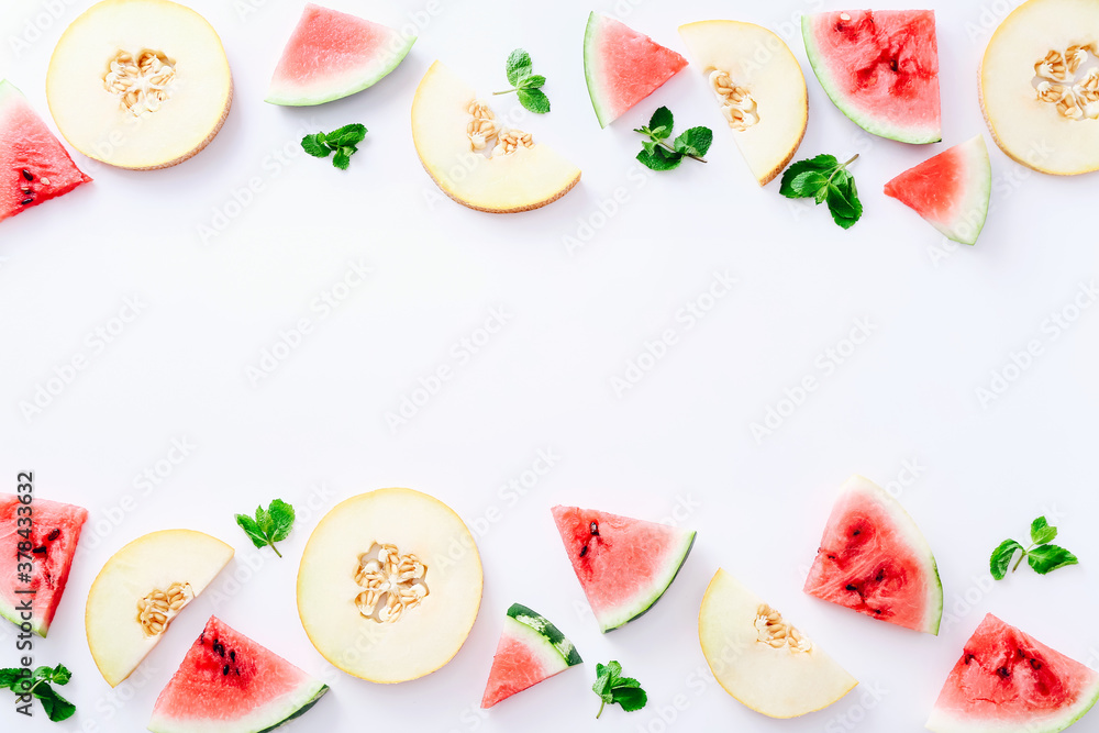 Frame of sliced watermelon and melon with mint leaves on white background. Top view Frame of sliced watermelon and melon with mint leaves on white background. Top view