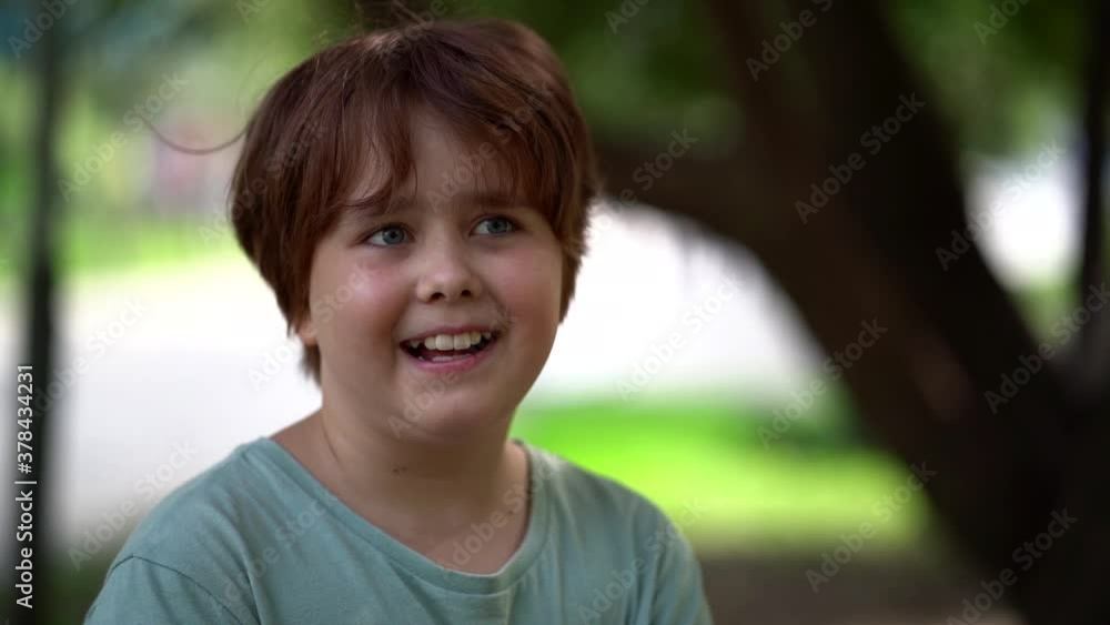 funny chubby child girl is sticking tongue and fooling in park, portrait of kid on nature funny chubby child girl is sticking tongue and fooling in park, portrait of kid on nature