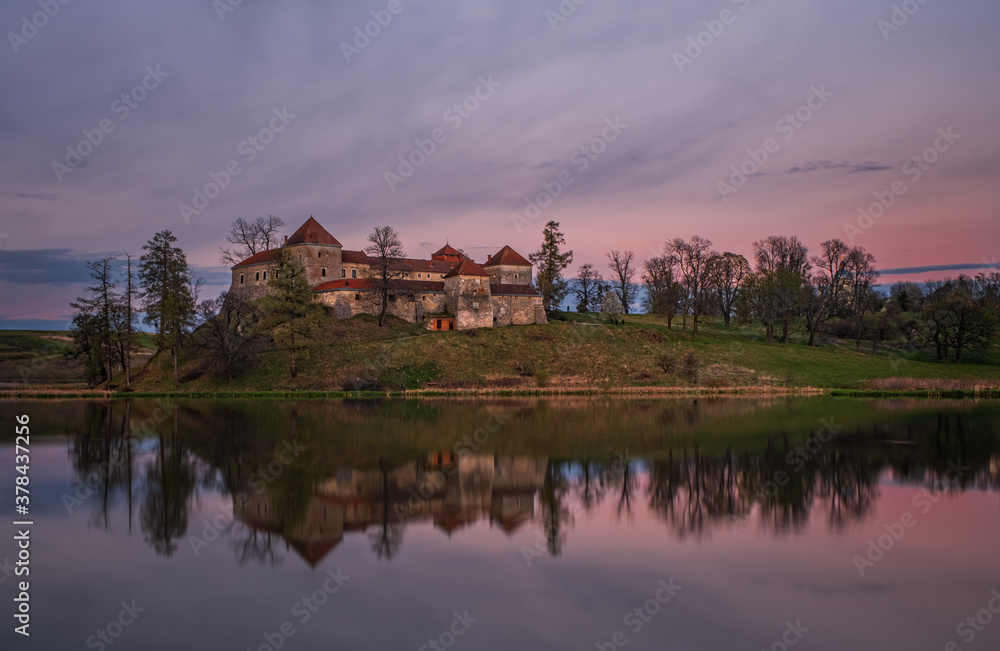 Ancient Svirzh castle at sunset in april 2020. Svirzh village, Lviv region. Ancient Svirzh castle at sunset in april 2020. Svirzh village, Lviv region.