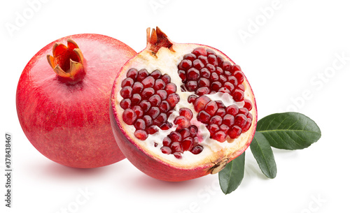 pomegranate with half of pomegranate and green leaves isolated on a white background photo