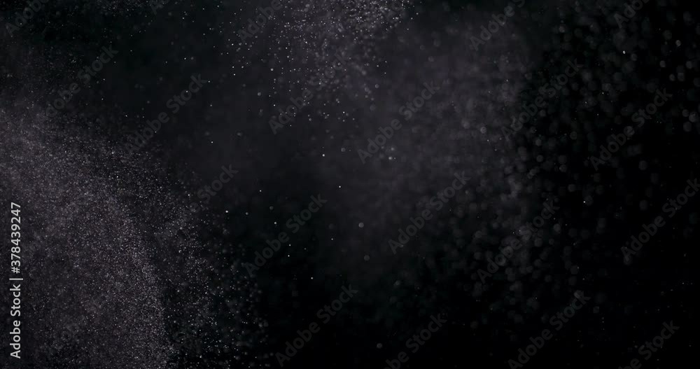 White dust powder isolated on black background White dust powder isolated on black background