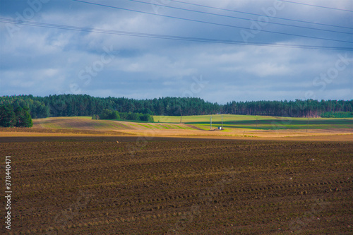 Obraz na płótnie Vast and sunlit, colorful farmland, field, rural landscape w salonie