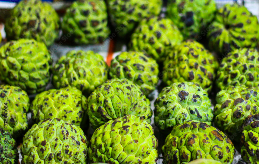 heap of sugar apple for sale in market heap of sugar apple for sale in market