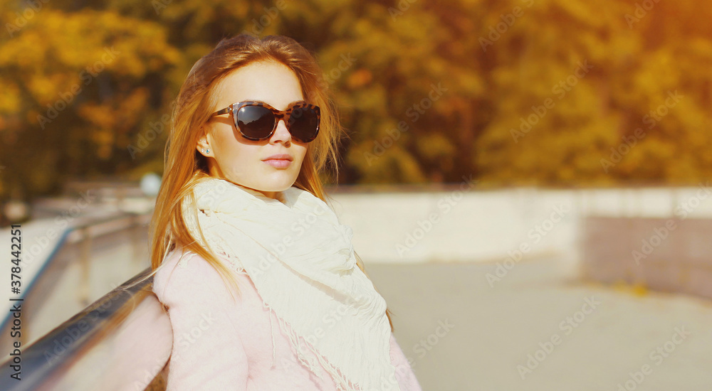 Portrait of beautiful young blonde woman in autumn park Portrait of beautiful young blonde woman in autumn park