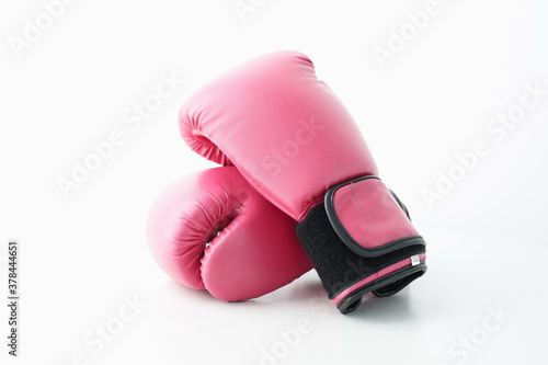 Red boxing gloves are depicted on a white background © Qwenergy
