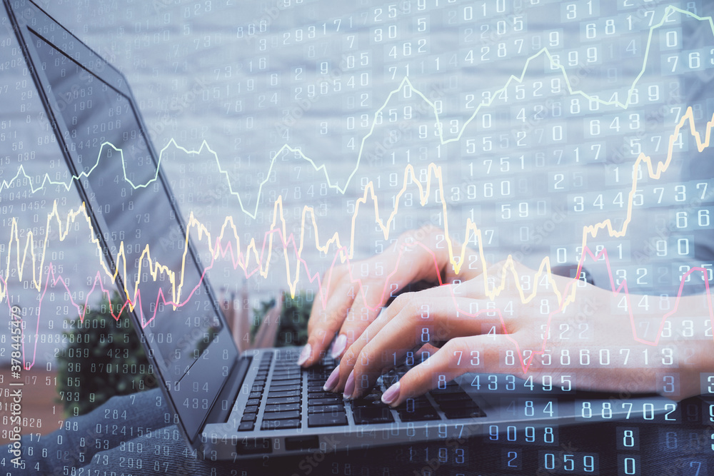 Multi exposure of woman hands typing on computer and forex chart hologram drawing. Stock market analysis concept. Multi exposure of woman hands typing on computer and forex chart hologram drawing. Stock market analysis concept.