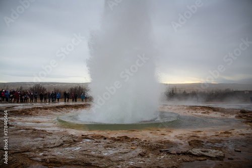 Volcanic geothermal geyser erupting water in Iceland