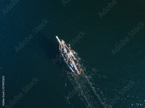 Aerial drone image of a two-masted schooner in Penobscot Bay Maine during a later afternoon cruise © Jorge Moro