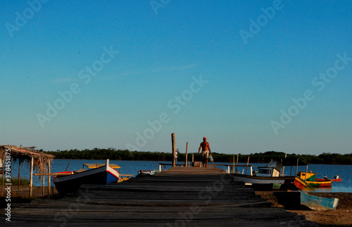 caravelas, bahia / brazil - june 16, 2009: wooden pier to access the port of fishing boats on the Caravelas River in the city of Caravelas, in the south of Bahia. photo