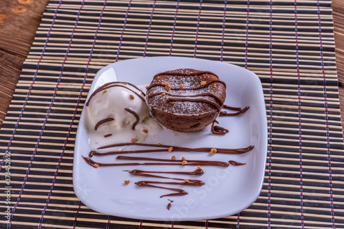 Mouth watering delicious chocolate fondant cake, restaurant serv photo