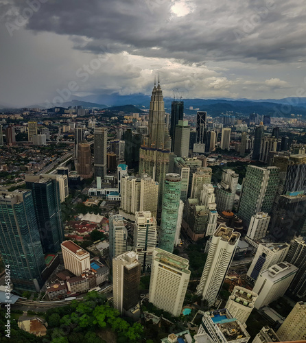 Kuala Lampur, Malaysia - November 2017. Photograph of the Kuala Lampur city from top of KL tower showing petronas twin towers and modern highrise buildings.