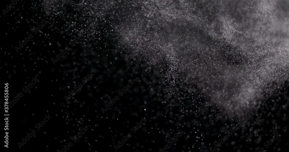 White dust powder isolated on black background White dust powder isolated on black background