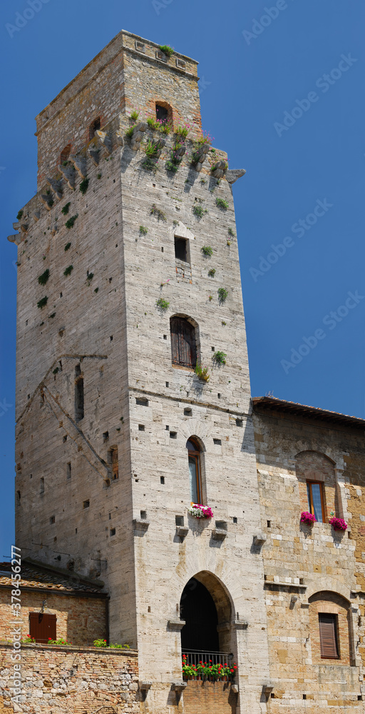 Cortesi Palace and the devils tower in Piazza della Cisterna San Gimignano