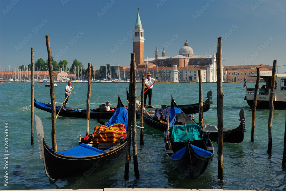 Gondoliers on Giudecca Canal in front of San Giorgio Maggiore in Venice