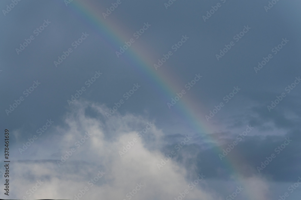 Rainbow in rural area of Guatemala, rain and mountains in open space, natural phenomenon.