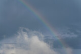 Rainbow in rural area of Guatemala, rain and mountains in open space, natural phenomenon.