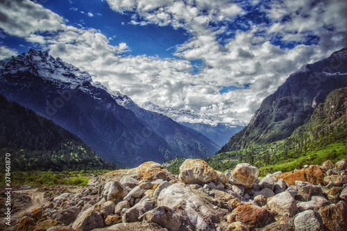 landscape photo of blue sky clouds mountain and rocks