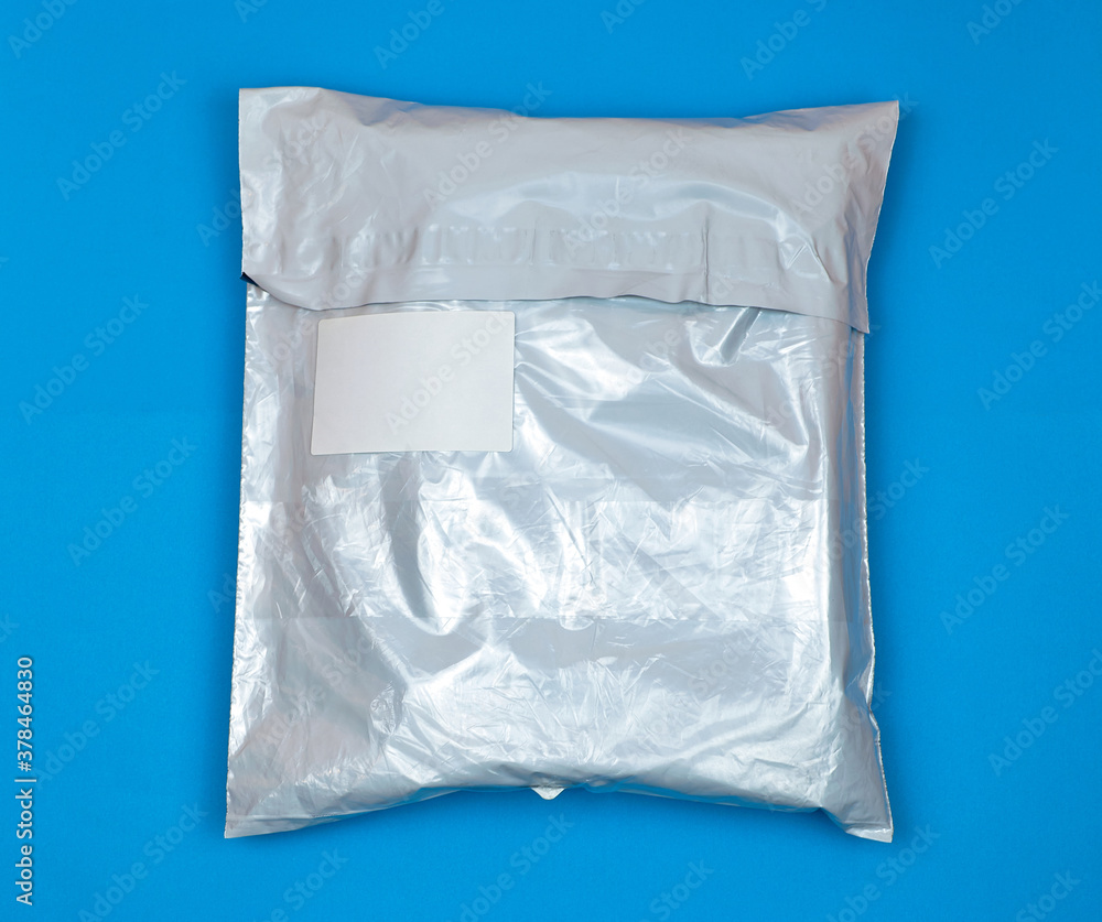 The parcel is in a plastic bag with a sticker about the information. Compact package. Save space on delivery and logistics. Packaging template