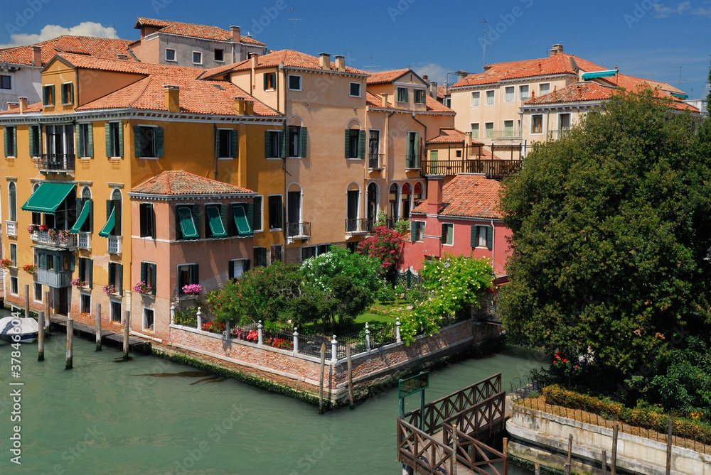 Orange houses on the Grand canal and Rio San Vidal in Venice