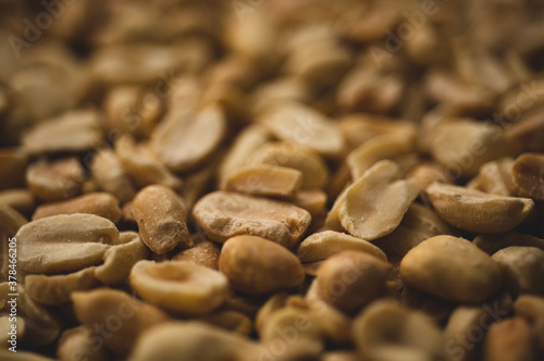 Macro close up portrait of organic peeled peanuts , studio lighting, selective focus