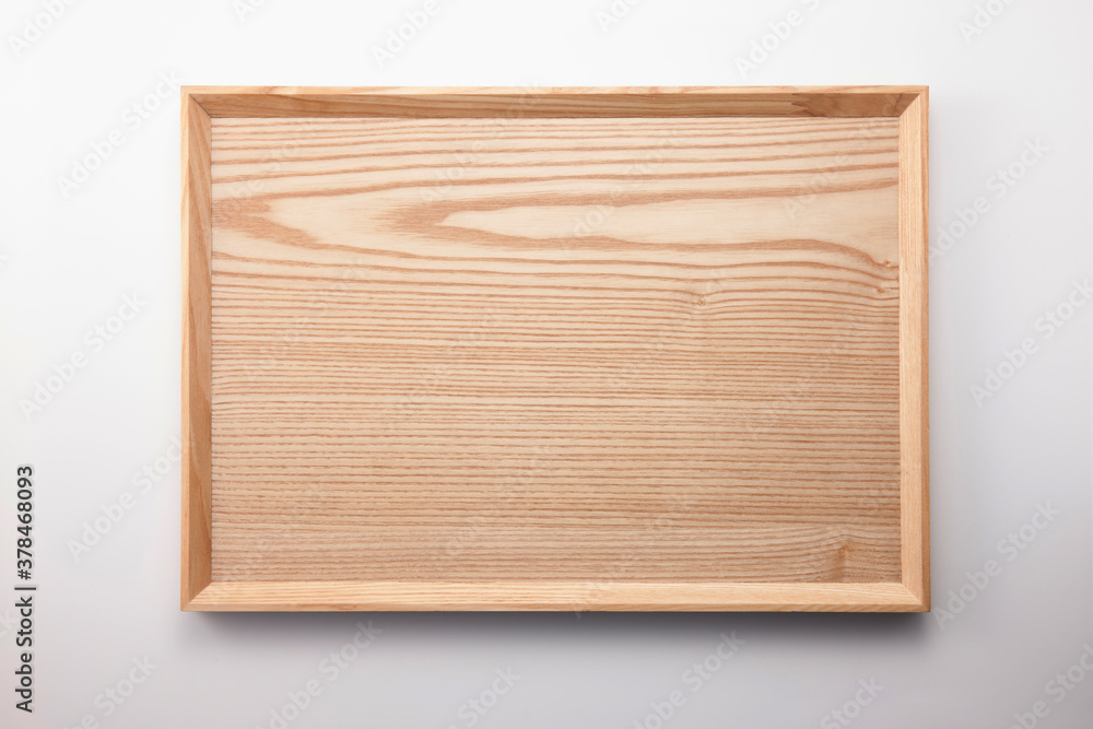 A square wood tray isolated white, top view at the studio.