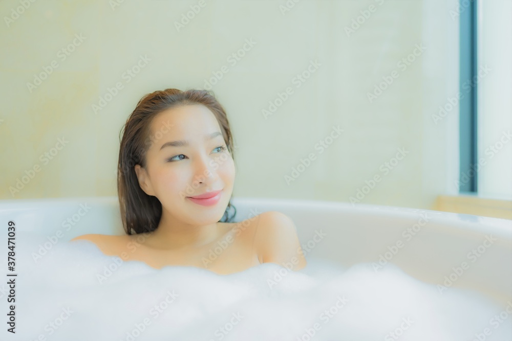Portrait beautiful young asian woman relax in bathtub interior of bathroom Portrait beautiful young asian woman relax in bathtub interior of bathroom