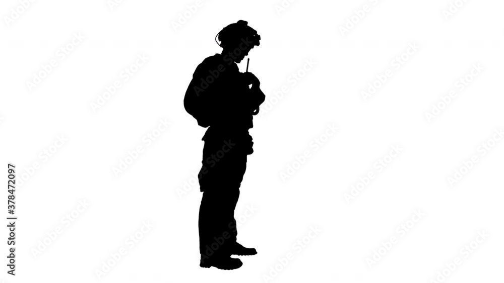 Soldier standing and talking on the radio, Alpha Channel Soldier standing and talking on the radio, Alpha Channel